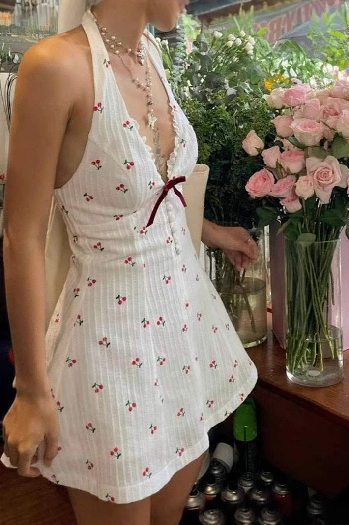 Rückenfreies Minikleid mit Neckholder und Druck in Weiß