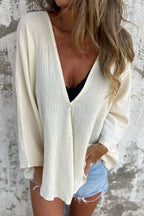 Locker geschnittene Strickjacke mit V-Ausschnitt und langen Ärmeln