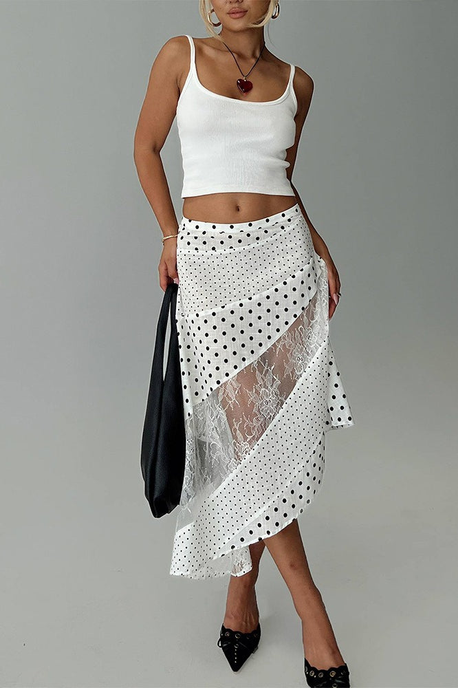 Asymmetrischer Rock mit Punktemuster und Netzdetails