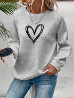 Lässiger Pullover mit Herzmotiv