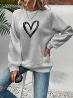 Lässiger Pullover mit Herzmotiv