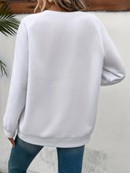 Lässiger Pullover mit Herzmotiv